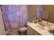 Bathroom with daisy shower curtain and vanity at 8999 Founders Cir, Palmetto, FL 34221