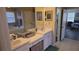 Double vanity bathroom with a large mirror and ample storage at 8999 Founders Cir, Palmetto, FL 34221