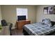 Bedroom with a dresser, TV, and large bed at 8999 Founders Cir, Palmetto, FL 34221