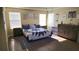 Spacious bedroom with large dresser, comfortable bed and plenty of natural light at 8999 Founders Cir, Palmetto, FL 34221