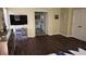 Spacious bedroom with wood-look floors and an ensuite bathroom at 8999 Founders Cir, Palmetto, FL 34221