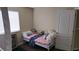 Small bedroom with a daybed and window coverings at 8999 Founders Cir, Palmetto, FL 34221