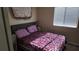 Cozy bedroom with a double bed and window coverings at 8999 Founders Cir, Palmetto, FL 34221