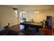 Game room with pool table and arcade game, ideal for entertainment at 8999 Founders Cir, Palmetto, FL 34221