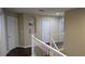 Upstairs hallway with doors to bedrooms and bathrooms at 8999 Founders Cir, Palmetto, FL 34221