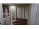 Upstairs hallway with doors to bedrooms and bathrooms at 8999 Founders Cir, Palmetto, FL 34221