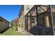Back of house with screened patio and pool at 8999 Founders Cir, Palmetto, FL 34221