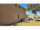 Side view of house showcasing tan exterior and AC units at 8999 Founders Cir, Palmetto, FL 34221