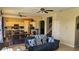 Open kitchen with island, stainless steel appliances, and dining area at 8999 Founders Cir, Palmetto, FL 34221