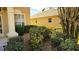 Neatly landscaped yard with green bushes and gravel at 8999 Founders Cir, Palmetto, FL 34221