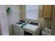 Laundry room with washer, dryer, and utility sink at 8999 Founders Cir, Palmetto, FL 34221