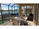 Spacious pool area with patio furniture and lake view at 8999 Founders Cir, Palmetto, FL 34221