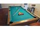 Well-maintained pool table ready for game play at 8999 Founders Cir, Palmetto, FL 34221