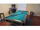 Classic pool table in a game room setting at 8999 Founders Cir, Palmetto, FL 34221