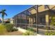 Large screened patio with pool and seating area, perfect for outdoor entertaining at 8999 Founders Cir, Palmetto, FL 34221