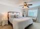 Main bedroom with a ceiling fan and cozy decor at 9709 Fredericksburg Rd, Tampa, FL 33635