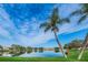 Tranquil lake view with lush landscaping and homes at 1010 Bowsprit Ln # 0, Holiday, FL 34691