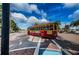 Image of a quaint street scene with a trolley and palm trees at 1010 Bowsprit Ln # 0, Holiday, FL 34691