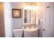 Cozy bathroom featuring vanity with a mirror, framed starfish art and a shower with a decorative curtain at 10405 N Woodmere Rd, Tampa, FL 33617