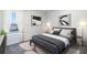 Bedroom with gray bedding, nightstands, and large window at 10588 Farm Hill Ave, Land O Lakes, FL 34638