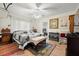 Main bedroom with king-size bed and sitting area at 1110 W Coral St, Tampa, FL 33602