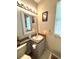 Clean bathroom with a vanity, toilet and a framed mirror at 1112 Lake Shore Ranch Dr, Seffner, FL 33584