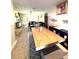 Dining room with a long wooden table and a view into the living room at 1112 Lake Shore Ranch Dr, Seffner, FL 33584