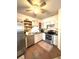 Kitchen with stainless steel appliances and light-colored cabinets at 1112 Lake Shore Ranch Dr, Seffner, FL 33584