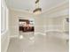 Formal dining room with chandelier and view to the kitchen at 11120 Kempton Vista Dr, Riverview, FL 33579