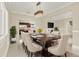 Dining room with large table, chandelier, and seating for eight at 11120 Kempton Vista Dr, Riverview, FL 33579