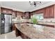 Kitchen with granite countertops and stainless steel appliances at 11120 Kempton Vista Dr, Riverview, FL 33579