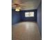 Large bedroom featuring blue walls and tile floors at 11122 Pembridge Ct # 2, Port Richey, FL 34668