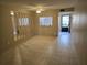 Simple dining room with tiled floors and mirrors at 11122 Pembridge Ct # 2, Port Richey, FL 34668