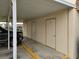 Covered parking area with three individual storage units at 11122 Pembridge Ct # 2, Port Richey, FL 34668