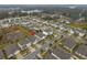 Aerial view of the house and surrounding neighborhood at 11520 Koti Creek Ln, Thonotosassa, FL 33592