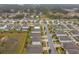 Aerial view of a residential neighborhood with houses and streets at 11520 Koti Creek Ln, Thonotosassa, FL 33592