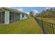 Backyard with pond and privacy fence at 11520 Koti Creek Ln, Thonotosassa, FL 33592