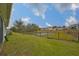 Backyard with pond and homes beyond at 11520 Koti Creek Ln, Thonotosassa, FL 33592