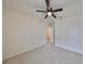 Bright bedroom with ceiling fan and carpet at 11520 Koti Creek Ln, Thonotosassa, FL 33592