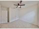 Bright bedroom with ceiling fan and neutral walls at 11520 Koti Creek Ln, Thonotosassa, FL 33592