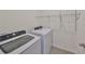 Laundry room with washer, dryer and shelving at 11520 Koti Creek Ln, Thonotosassa, FL 33592