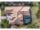 Bird's-eye view of home with tile roof and pool at 11938 Royce Waterford Cir, Tampa, FL 33626