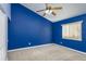 Blue bedroom with ceiling fan and window at 11938 Royce Waterford Cir, Tampa, FL 33626