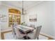 Elegant dining room featuring a wood table and pink velvet chairs at 11938 Royce Waterford Cir, Tampa, FL 33626