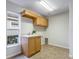 Laundry room with cabinets and countertop at 11938 Royce Waterford Cir, Tampa, FL 33626