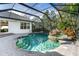 Inviting pool area with spa and covered patio at 11938 Royce Waterford Cir, Tampa, FL 33626