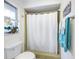 Clean bathroom with shower/tub combo and window at 1230 Nelson St, Dunedin, FL 34698