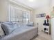 Bedroom with daybed and backyard access at 1230 Nelson St, Dunedin, FL 34698