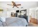 Spacious bedroom with dresser, ceiling fan and large bed at 1230 Nelson St, Dunedin, FL 34698