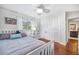 Well-lit bedroom with a full-size bed and built-in closet at 1230 Nelson St, Dunedin, FL 34698